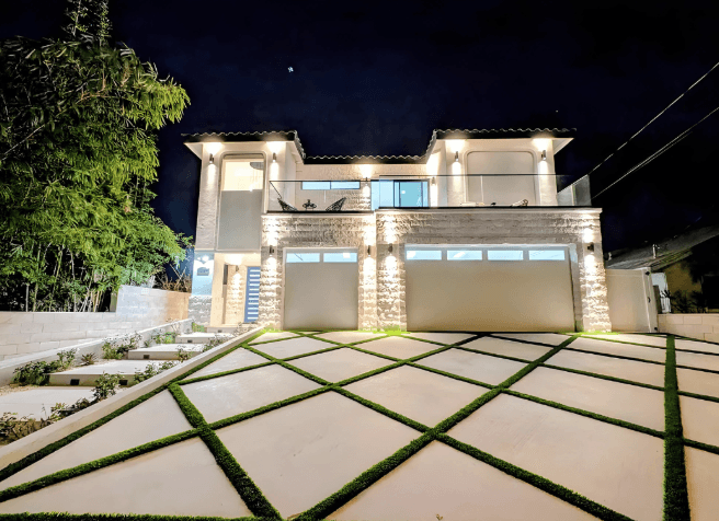 Modern single family residence exterior at night