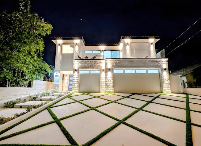 Modern single family residence exterior at night
